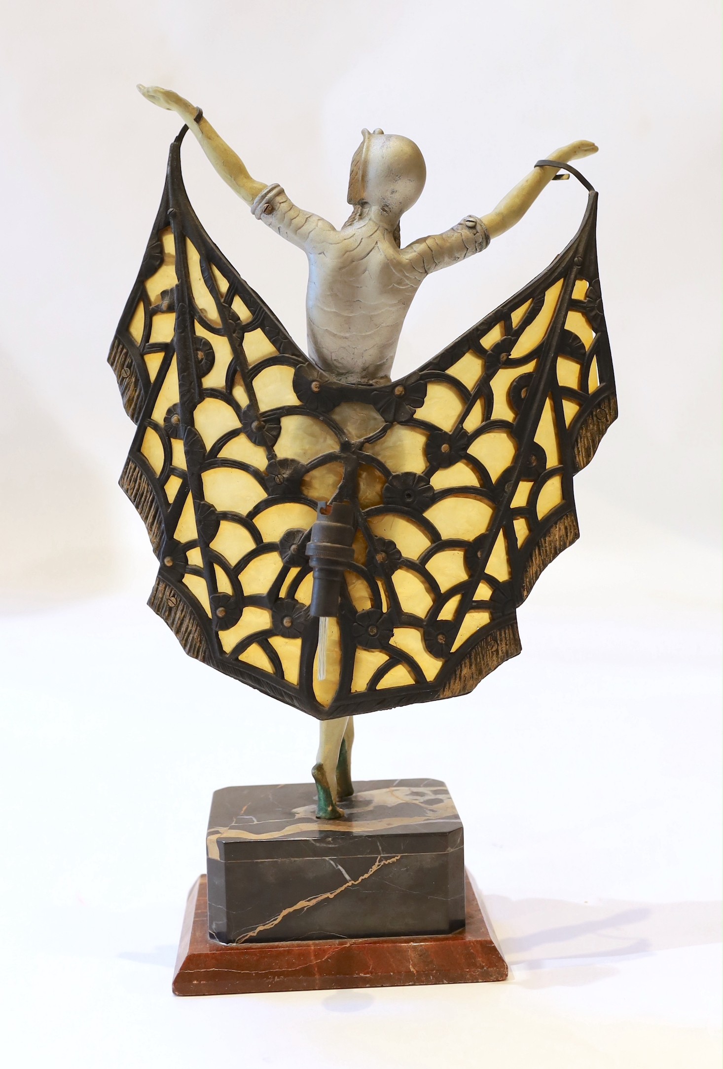 A 1920s French composition and metal butterfly dancer table lamp, on marble plinth, height 42cm